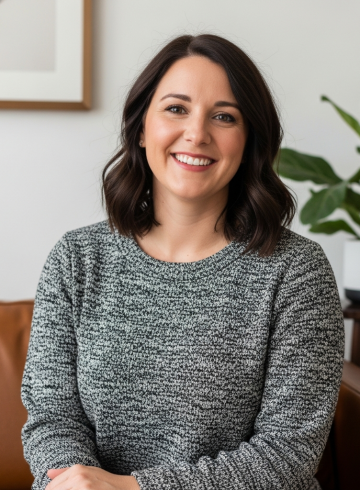 Colleen Langdon, a designer in a warm, edited living room that reflects her calm, livable design approach.